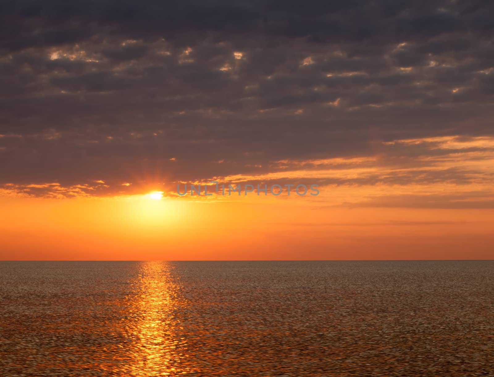 Beautiful seascape with orange warm sunrise, vacation concept