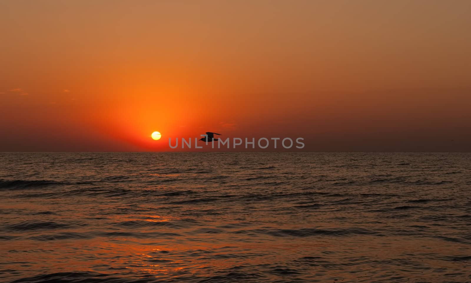 Beautiful seascape with orange warm sunrise, vacation concept