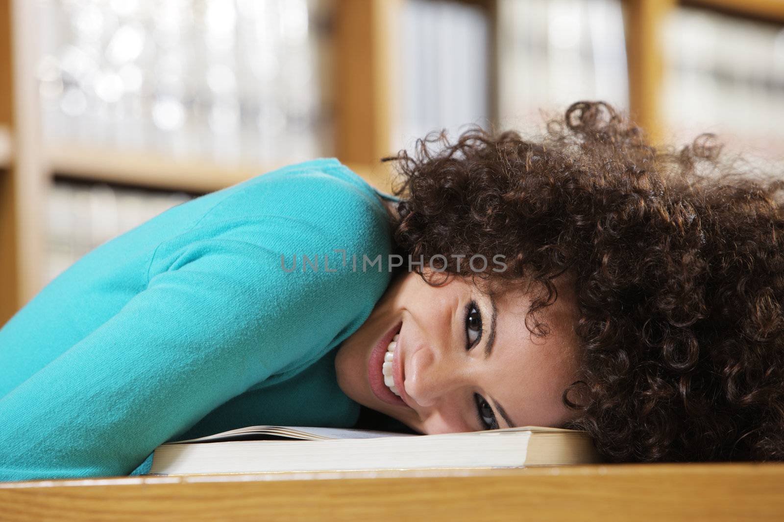 Portrait of happy female student in library