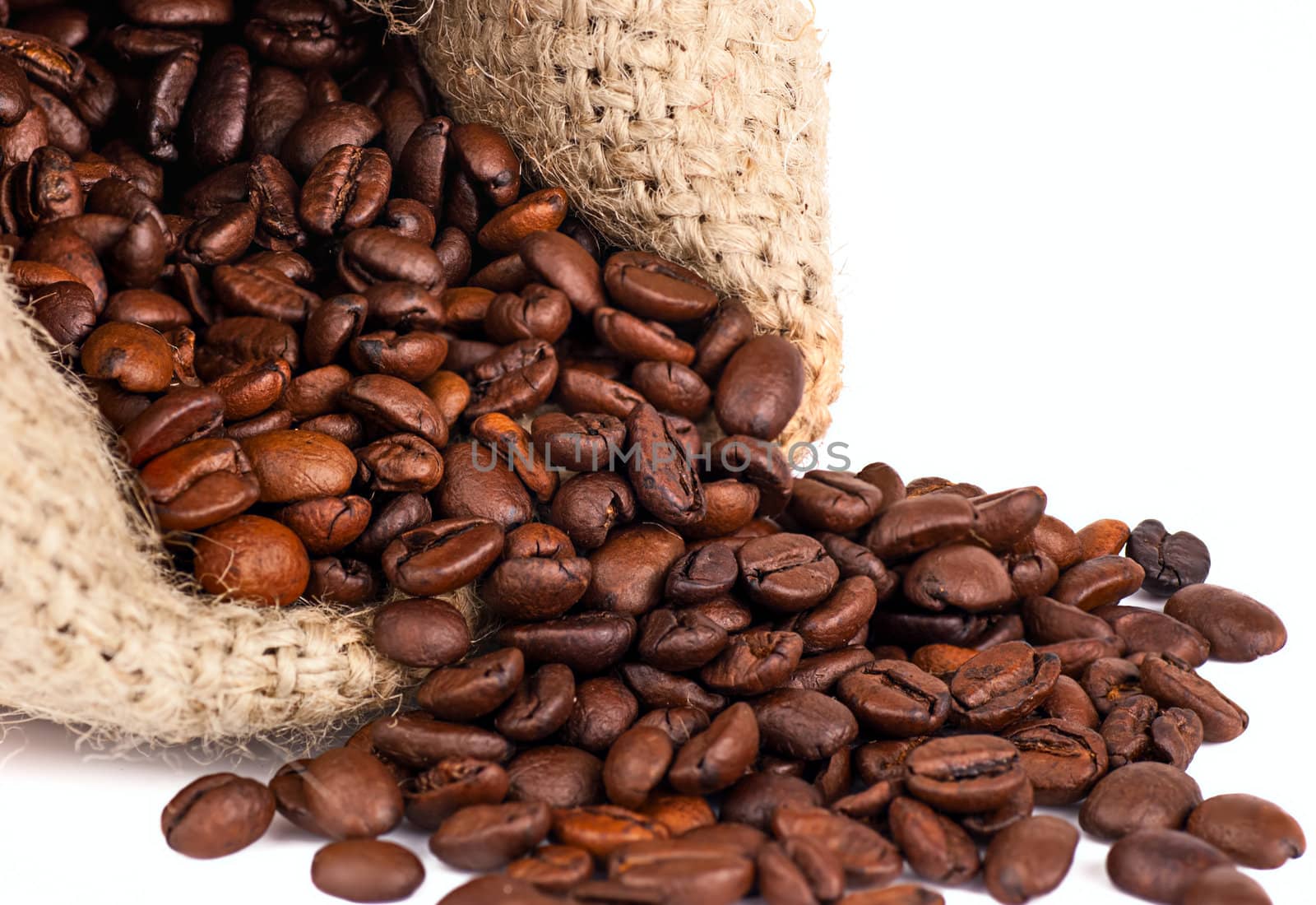 scattered coffee grains on a white background by Zhukow