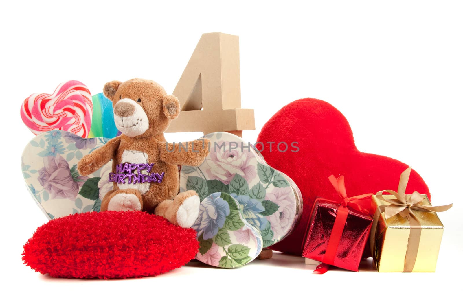 Number of age in a colorful studio setting with heart and gifts and yellow roses