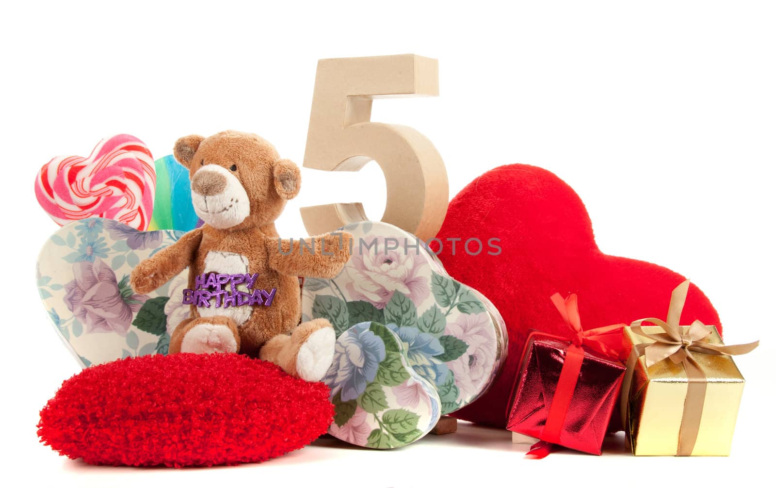 Number of age in a colorful studio setting with heart and gifts and yellow roses