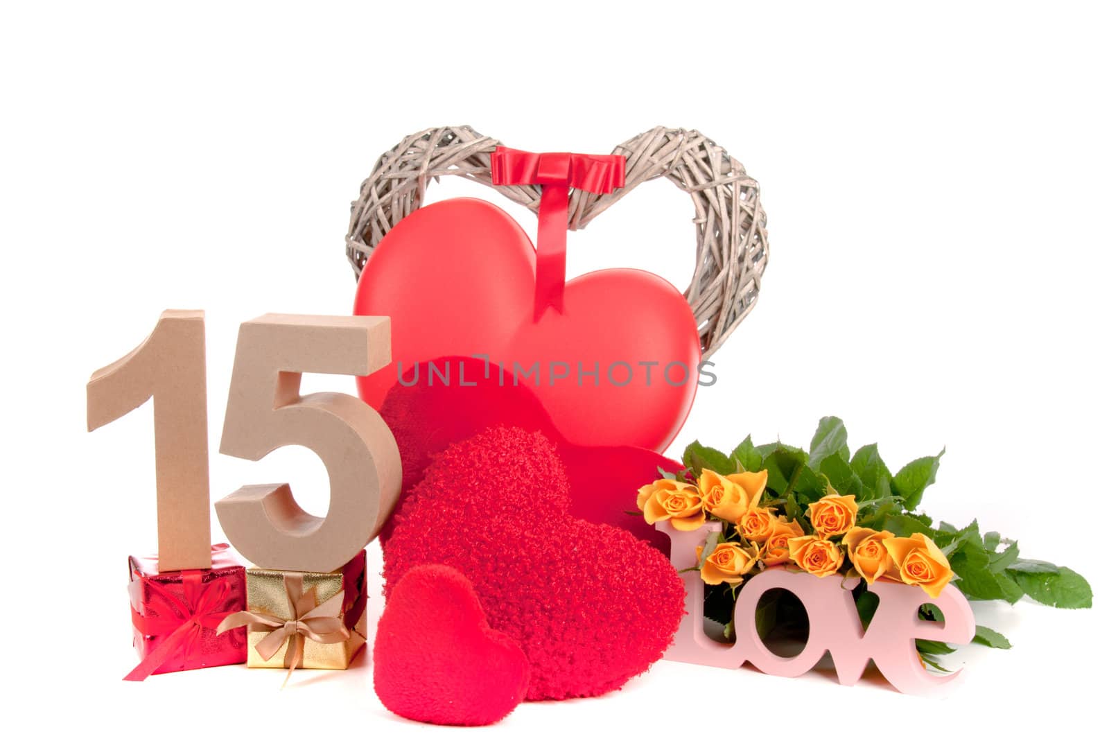 Number of age in a colorful studio setting with heart and gifts and yellow roses