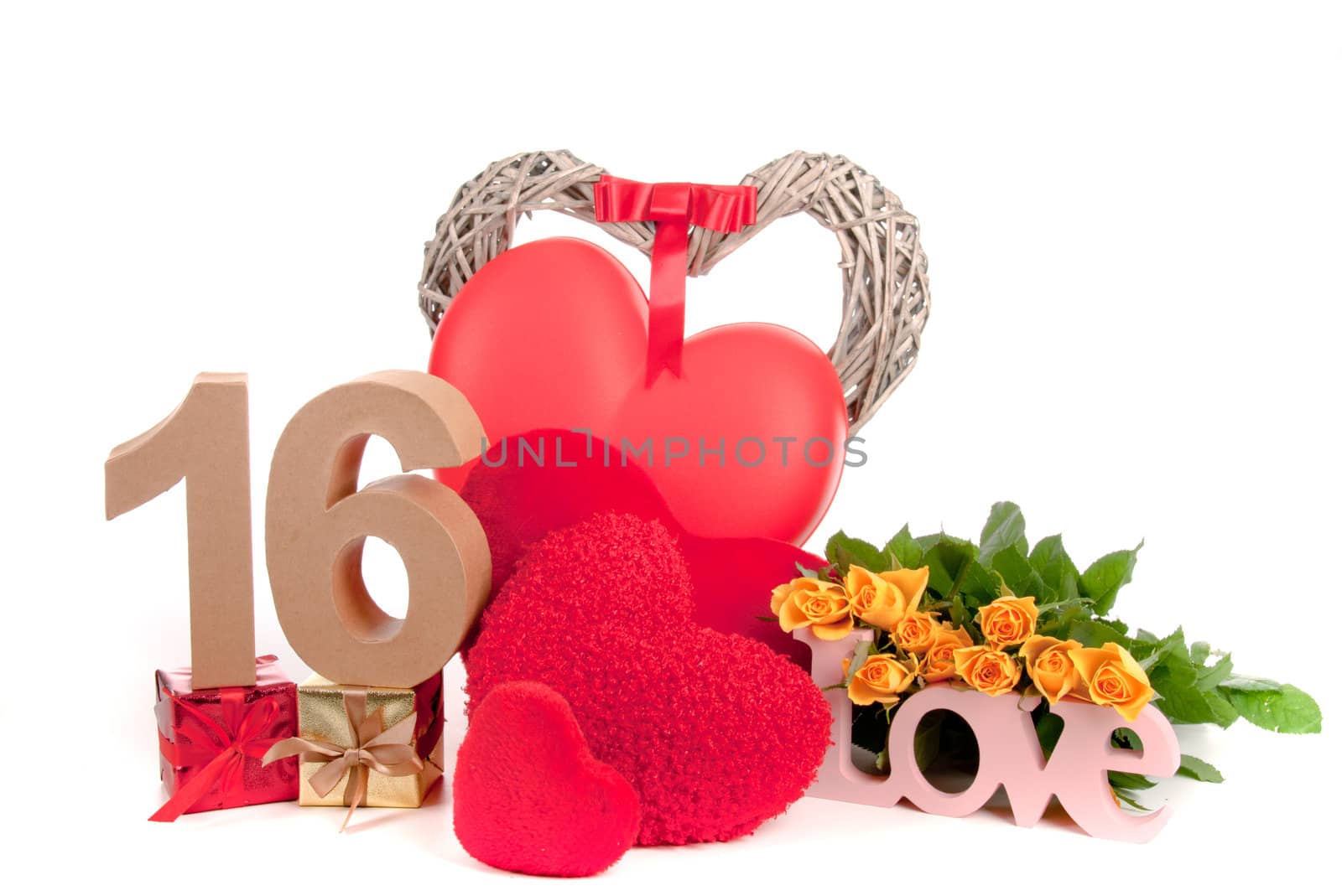 Number of age in a colorful studio setting with heart and gifts and yellow roses