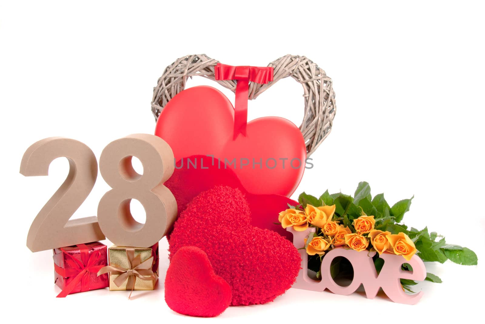 Number of age in a colorful studio setting with heart and gifts and yellow roses