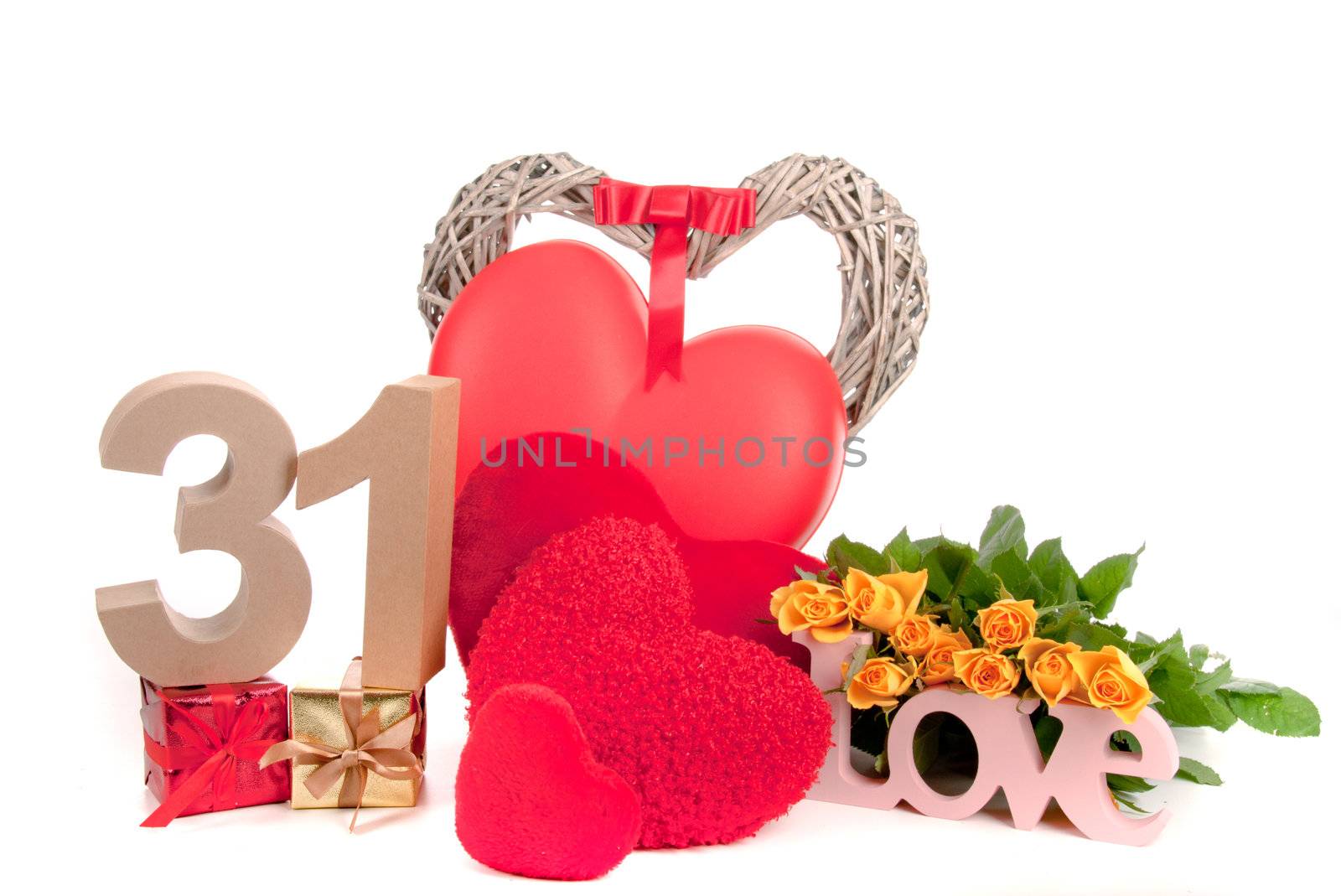 Number of age in a colorful studio setting with heart and gifts and yellow roses