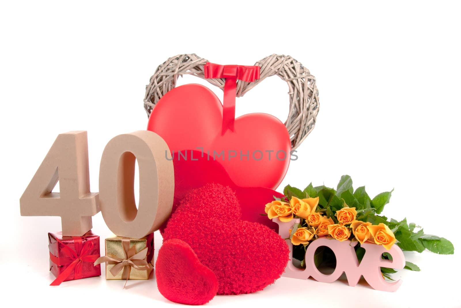 Number of age in a colorful studio setting with heart and gifts and yellow roses