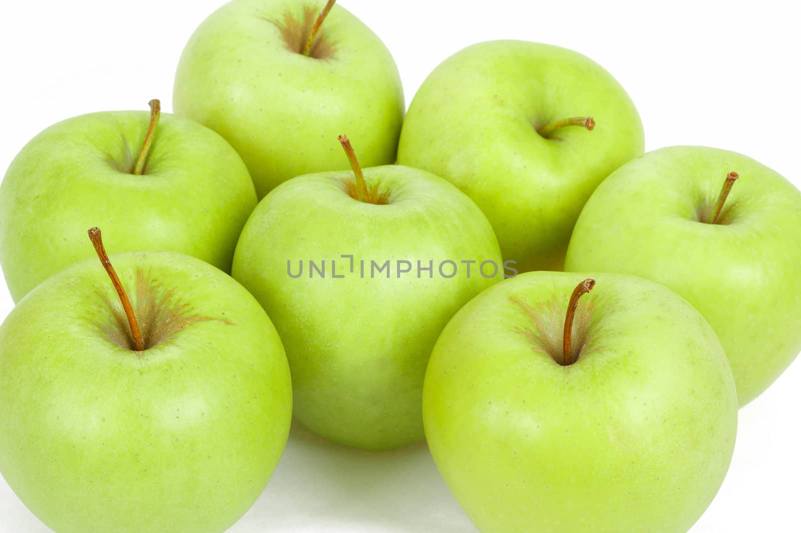 fresh seven green apples isolated on a white background 