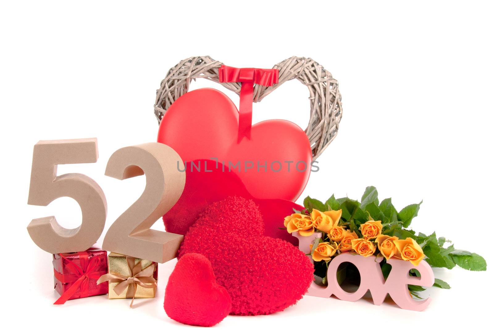 Number of age in a colorful studio setting with heart and gifts and yellow roses