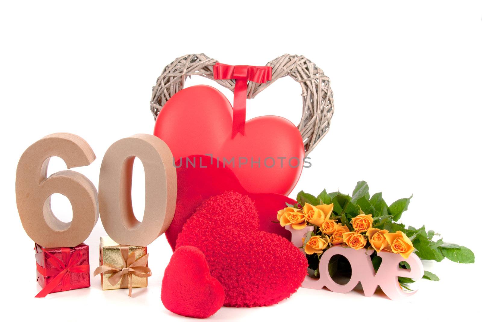 Number of age in a colorful studio setting with heart and gifts and yellow roses