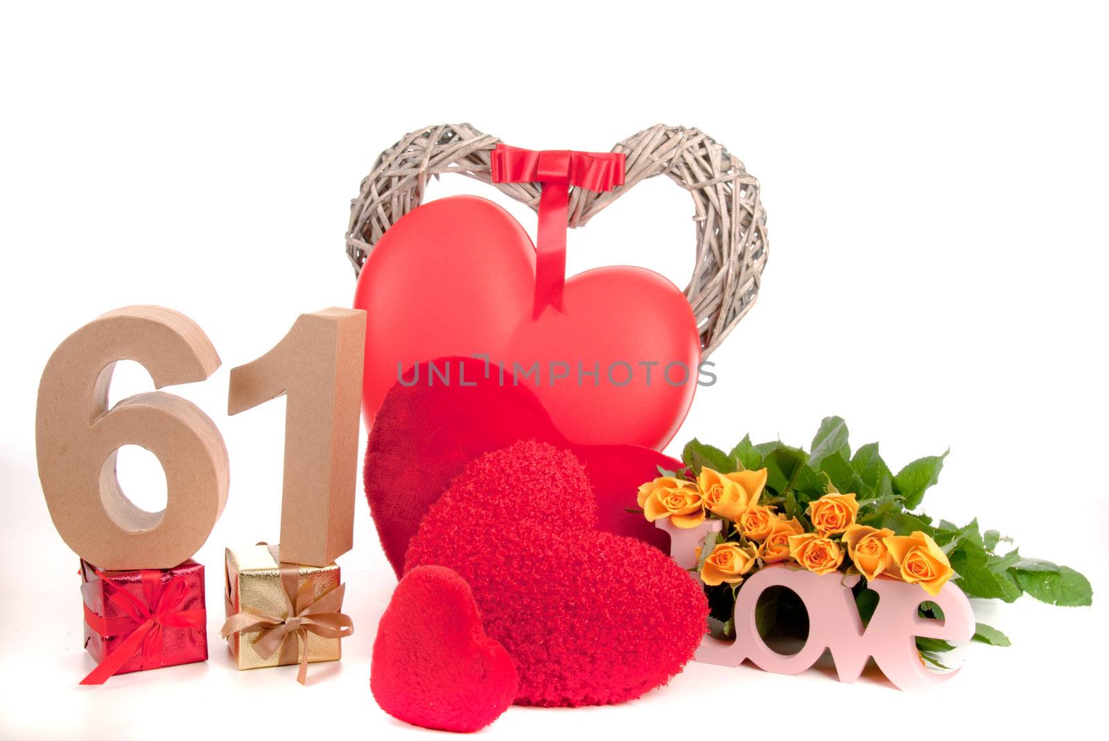 Number of age in a colorful studio setting with heart and gifts and yellow roses
