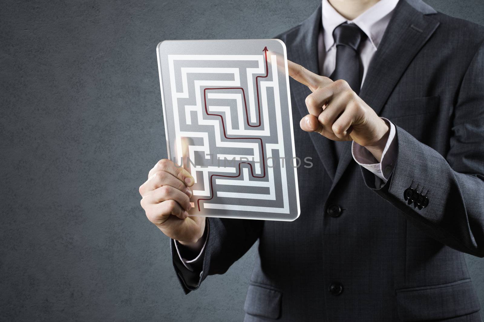 Businessman with solutions of maze