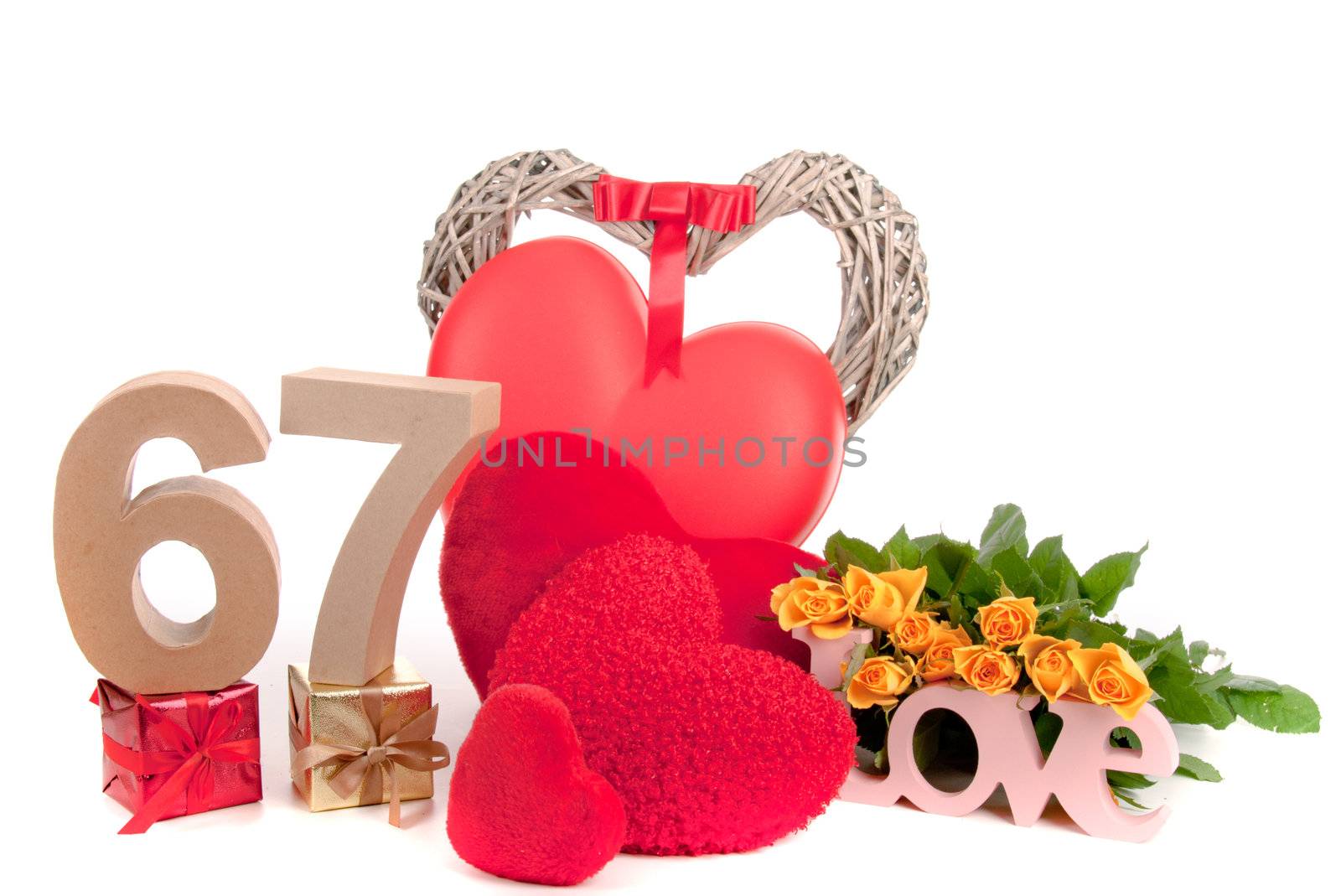 Number of age in a colorful studio setting with heart and gifts and yellow roses