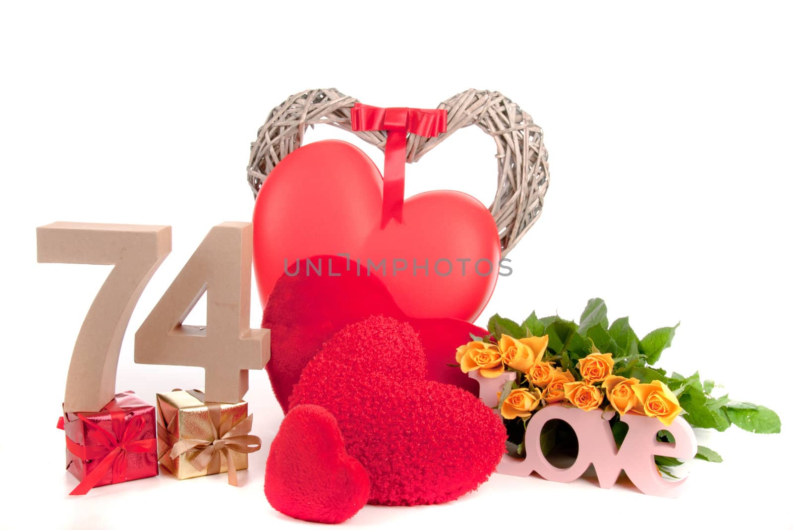 Number of age in a colorful studio setting with heart and gifts and yellow roses