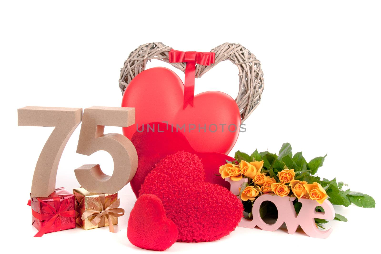 Number of age in a colorful studio setting with heart and gifts and yellow roses