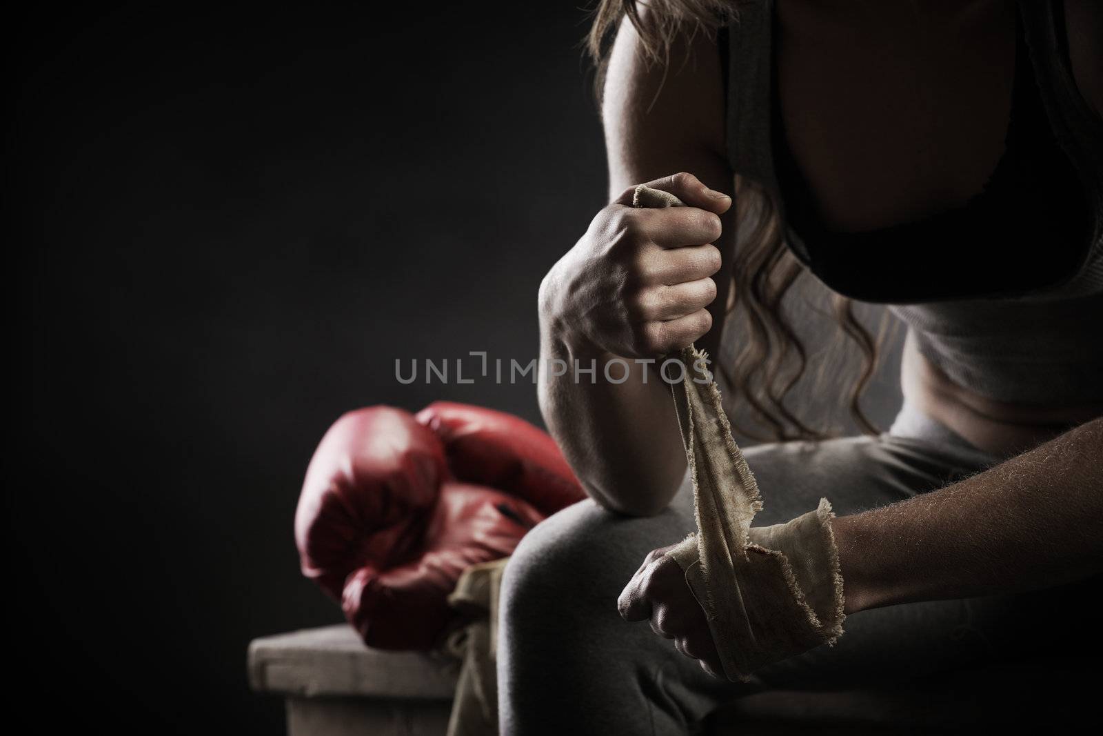 Woman boxer wearing white strap on wrist