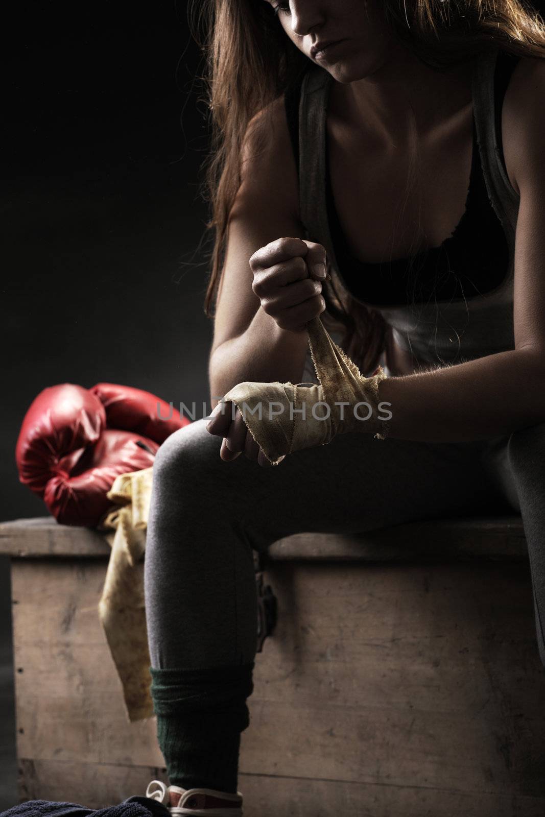 Woman boxer wearing white strap on wrist