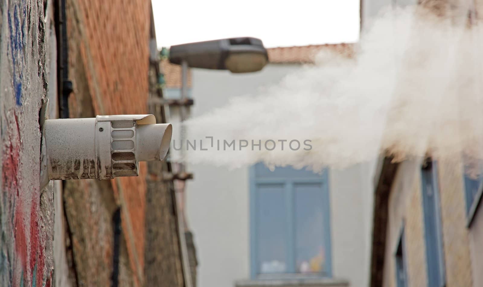 cloud of vapor escaping from an outside pipe