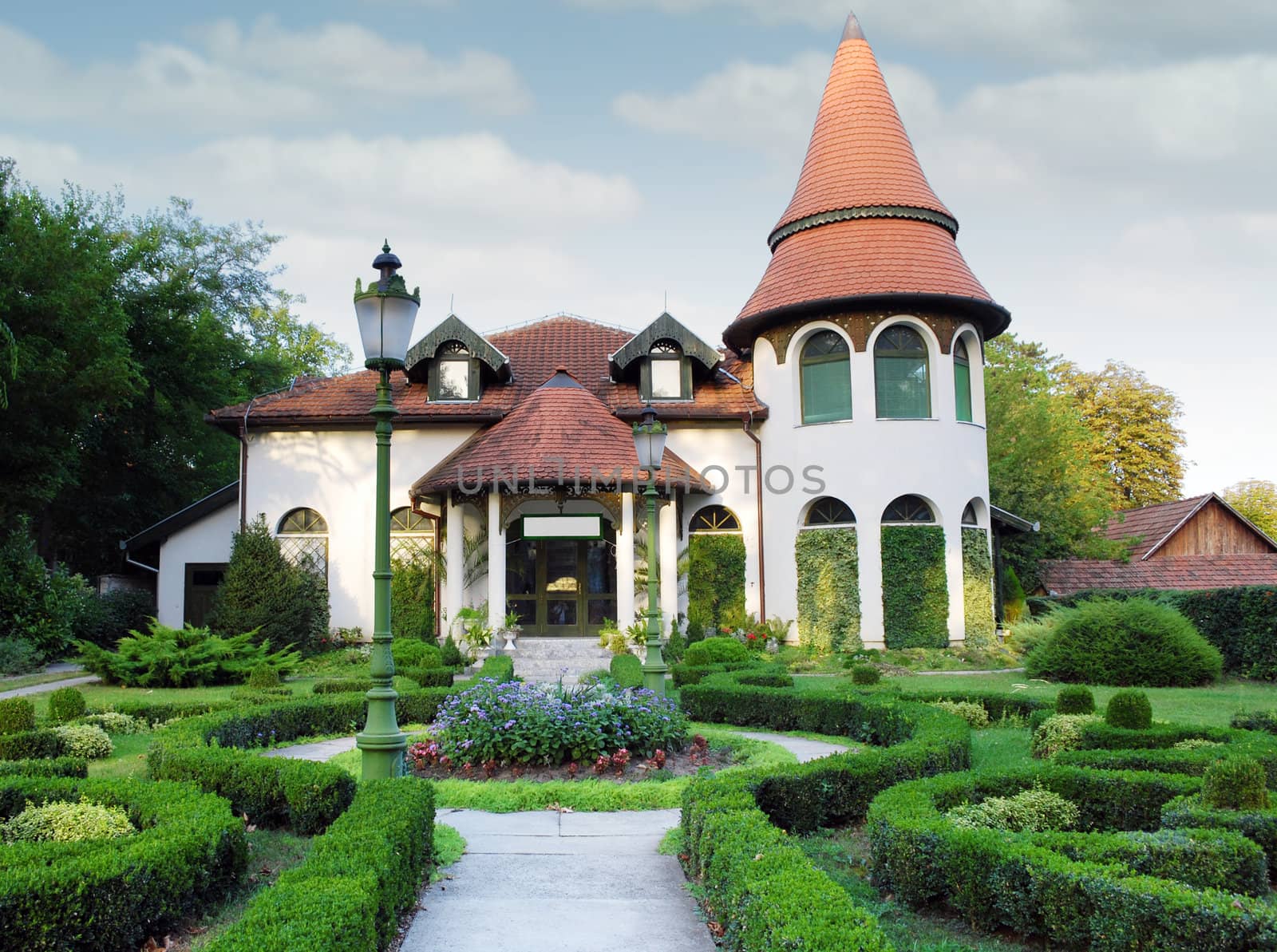 little castle with hedgerow yard