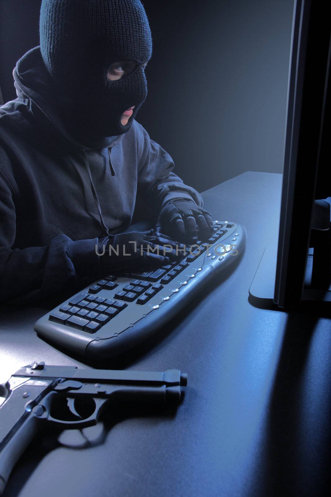 Computer hacker - Male thief stealing data from laptop