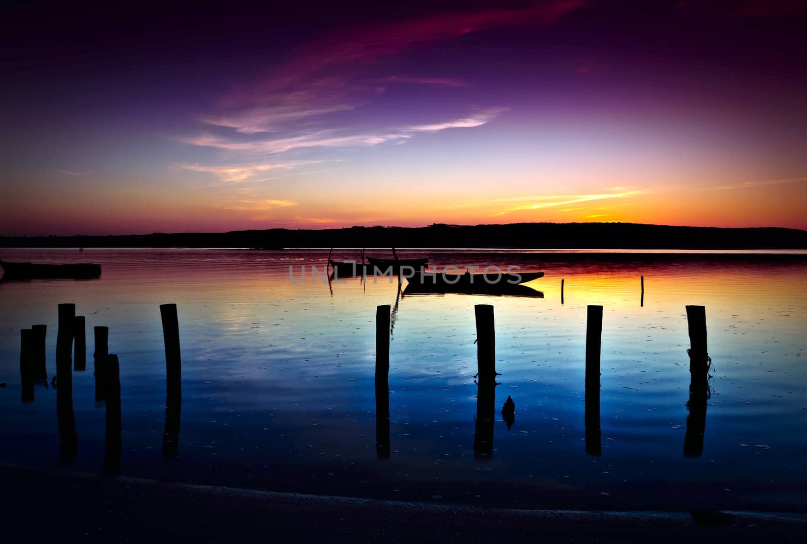 Beautiful landscape of a river and boats at sunset