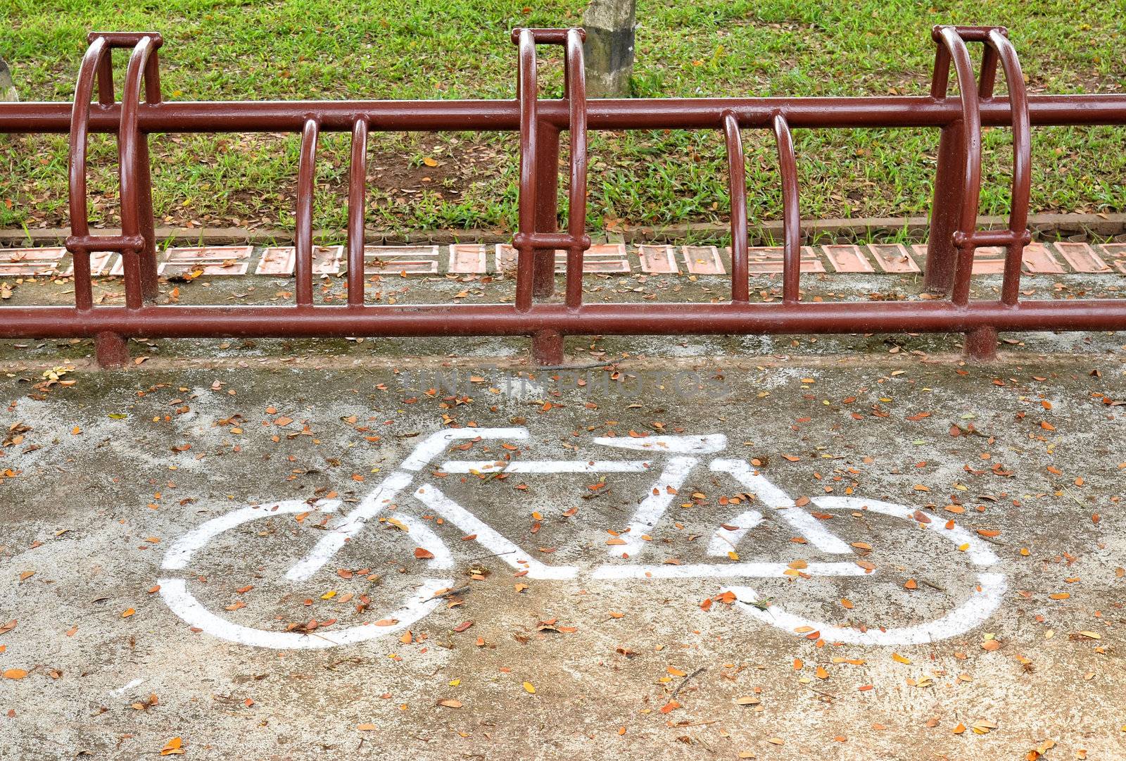 A sign of bicycle path  and Parking