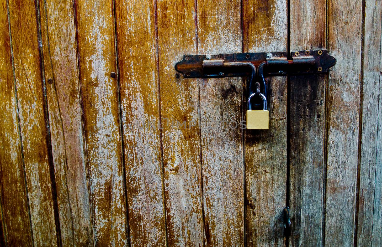 Old wood door with Lock2 by gjeerawut