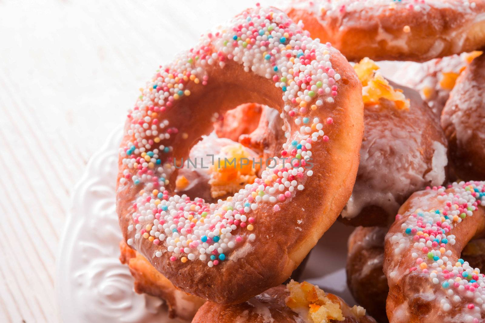 bismarck doughnuts on a plate by Darius.Dzinnik