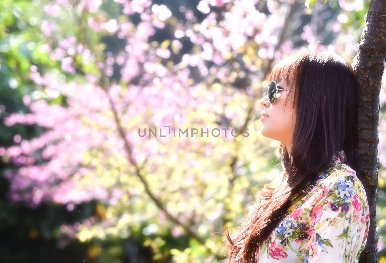 beautiful sad young woman in the garden