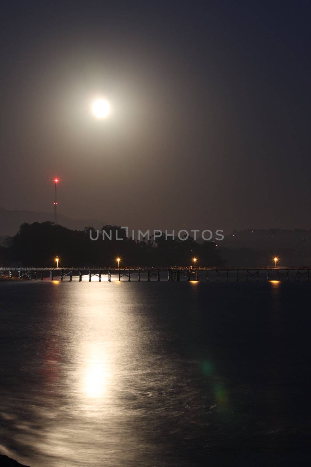 Full moon rise over the Goleta pier.