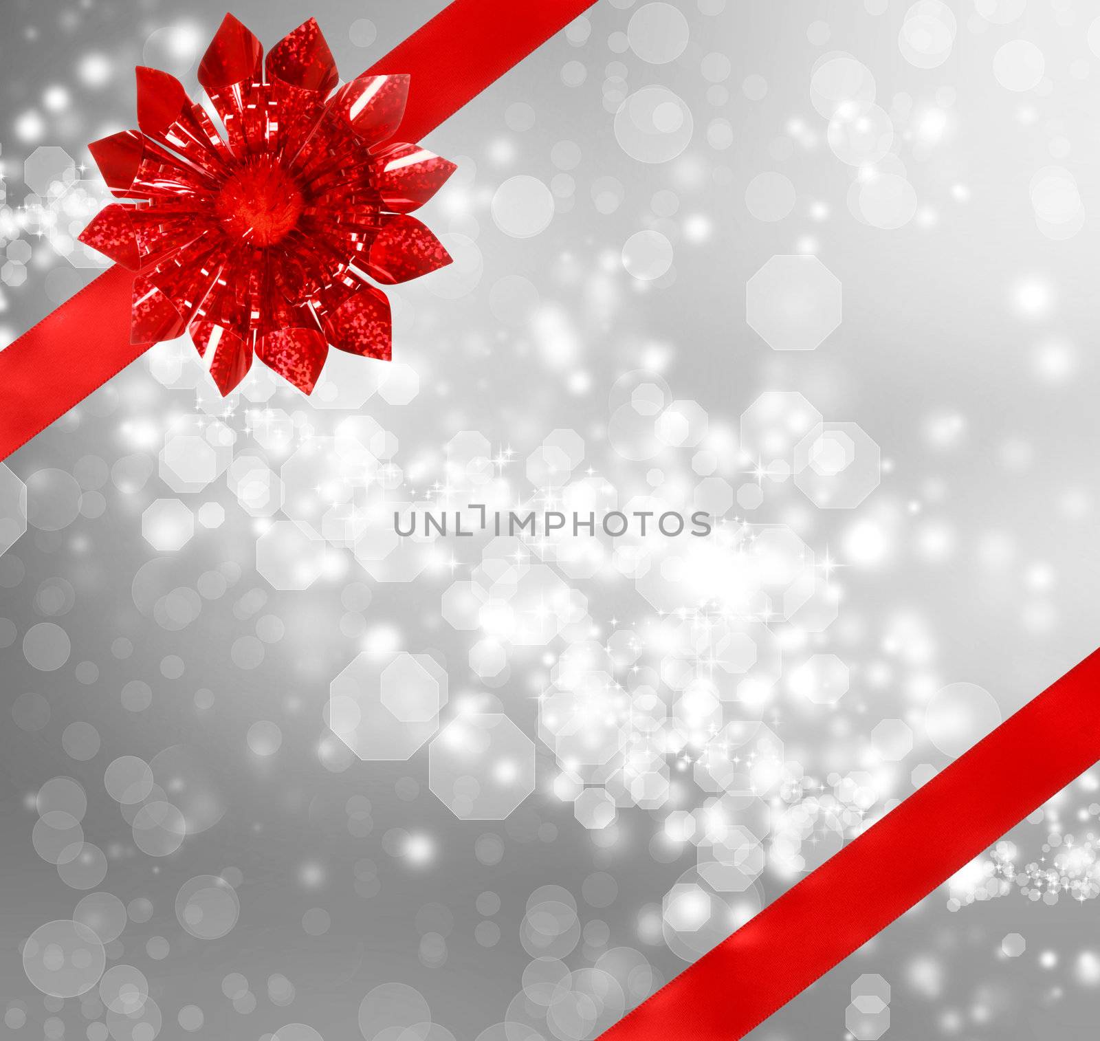 Red Bow and Ribbon with Silver Abstract Lights Background 
