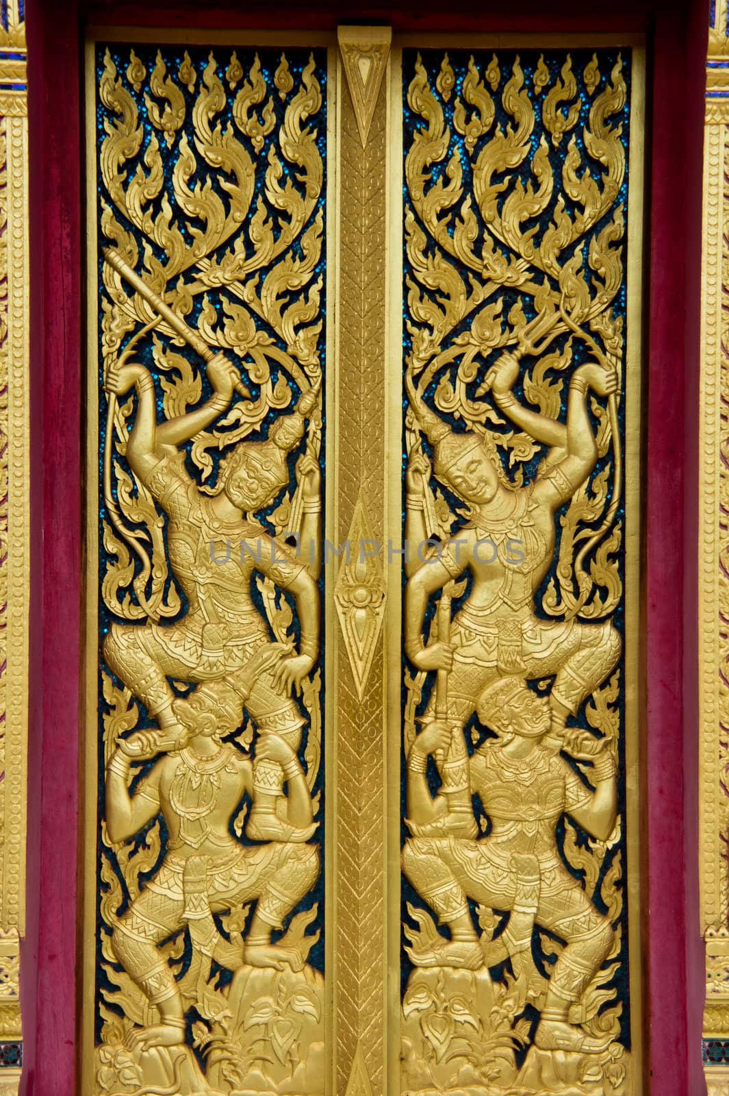 Door carvings gold In Wat Kuhasawan, at Thai temples in southern Thailand.