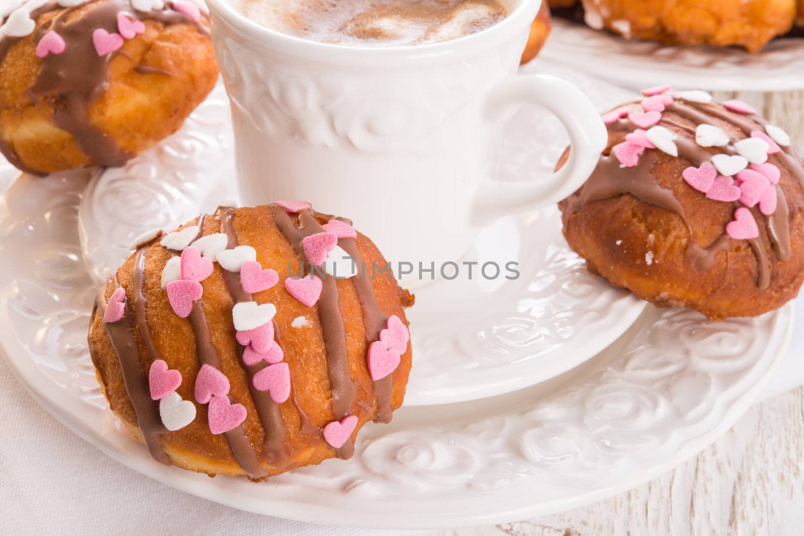bismarck doughnuts on a plate by Darius.Dzinnik
