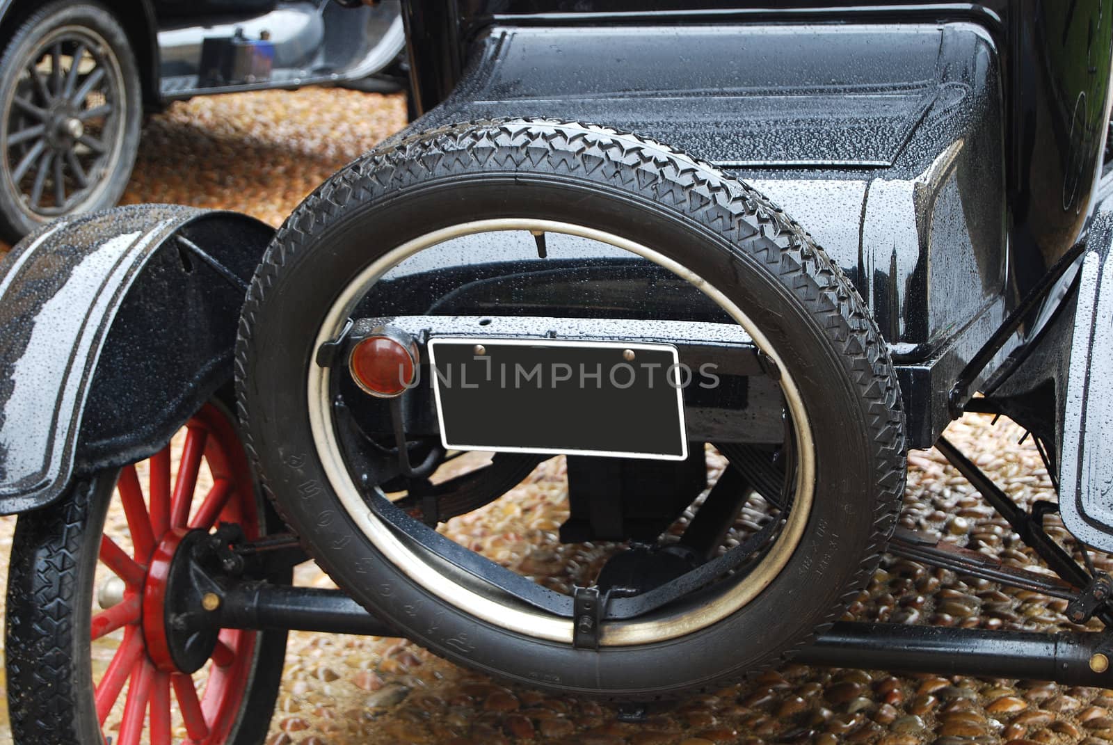 Black retro car back side, spare wheel closeup