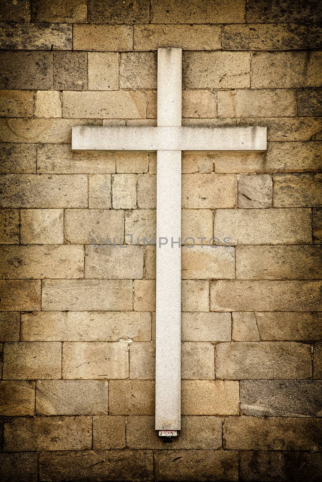 White cross on a wall Santiago de Compostela, Galicia - Spain.