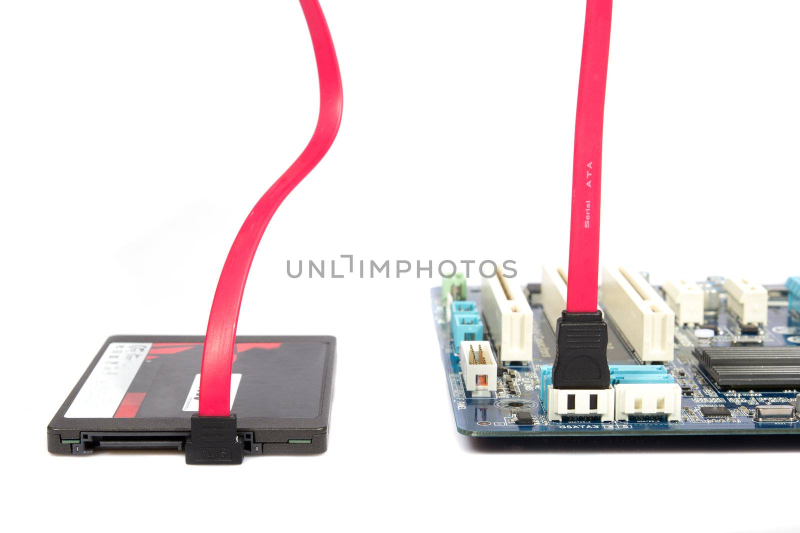 SSD disk and sata connection on the computer motherboard on a white background