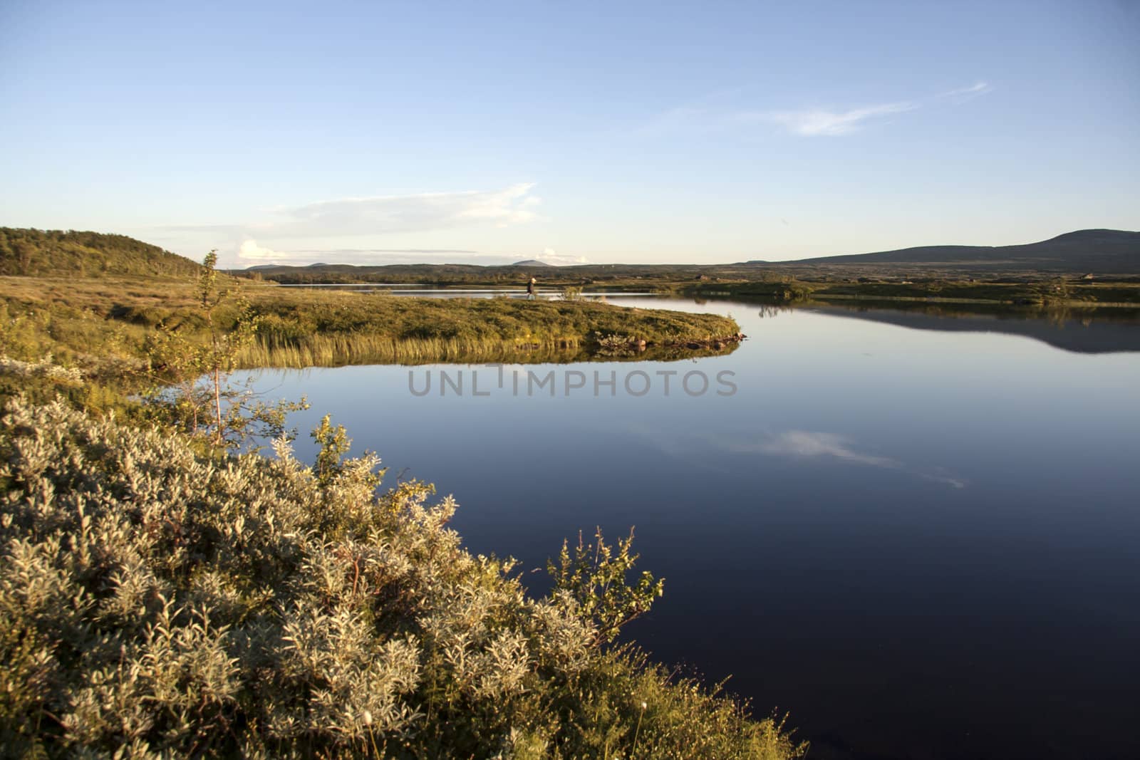 landscape of blue sky and lake