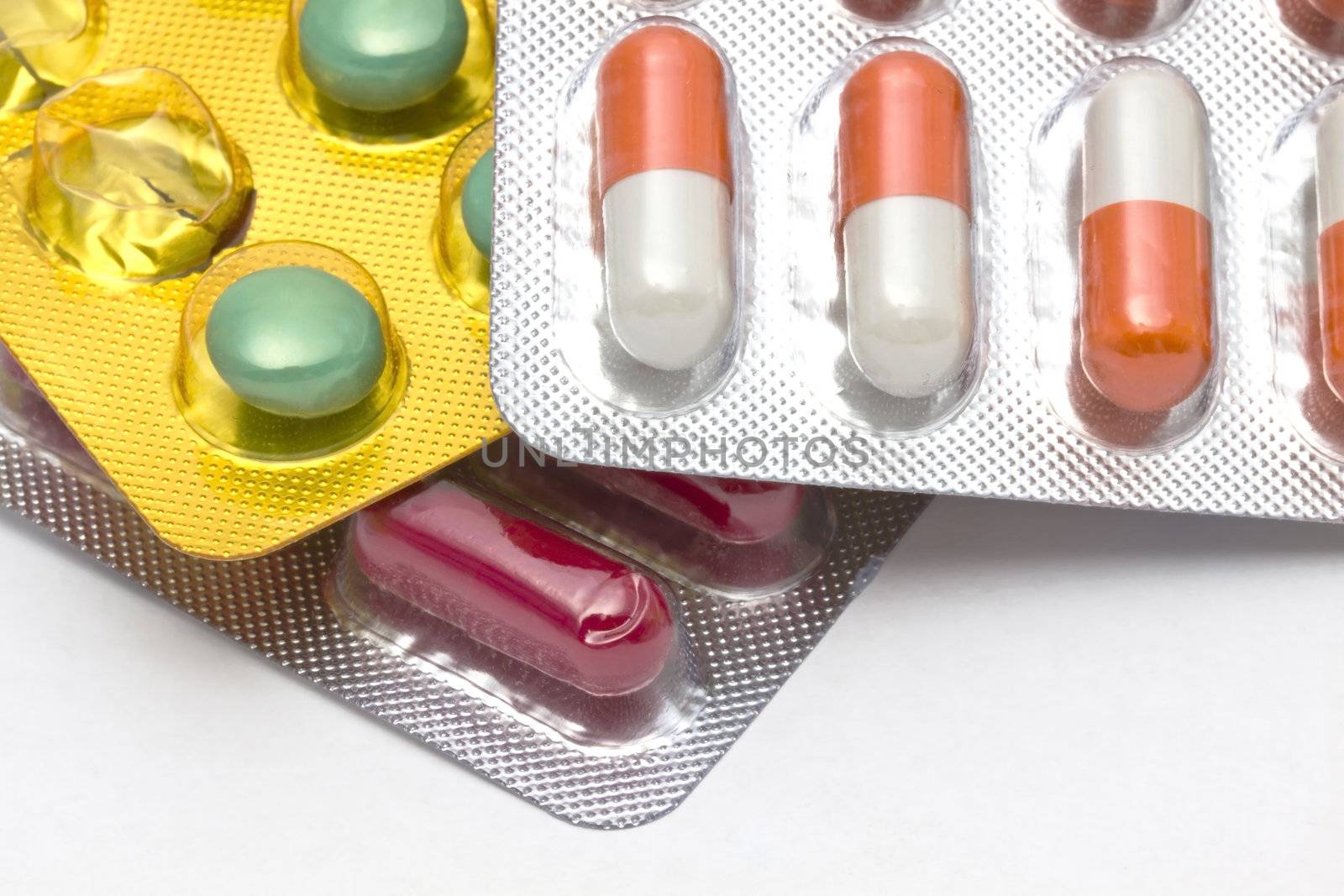 Colorful pills closeup on white background 
