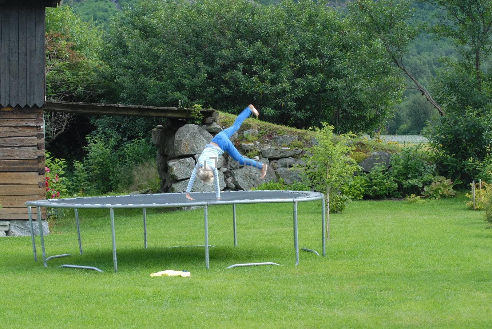 Girl exercising on trampoline