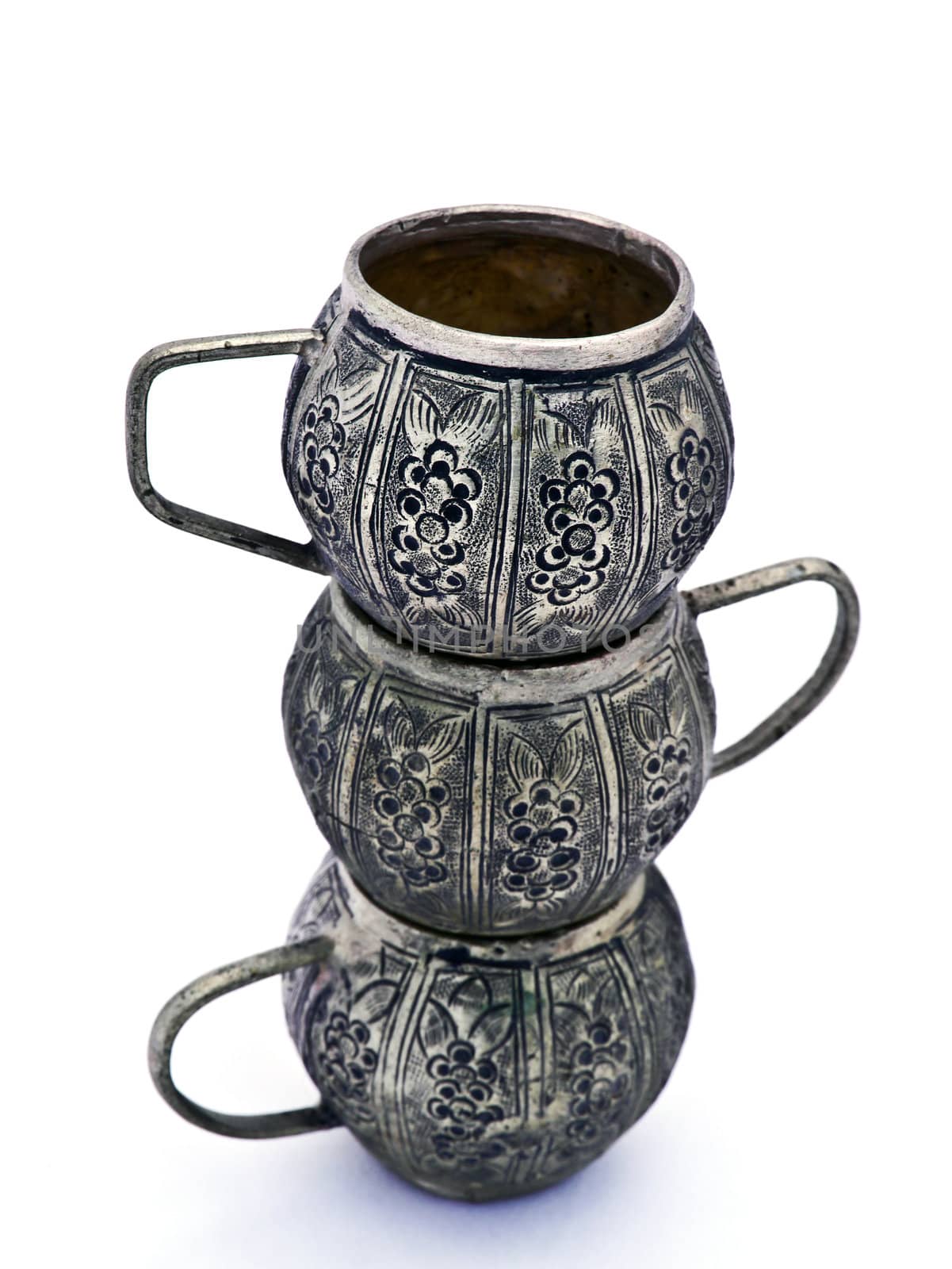 Antique tea pot and cups made ​​of metal, isolated on a whit by Noppharat_th