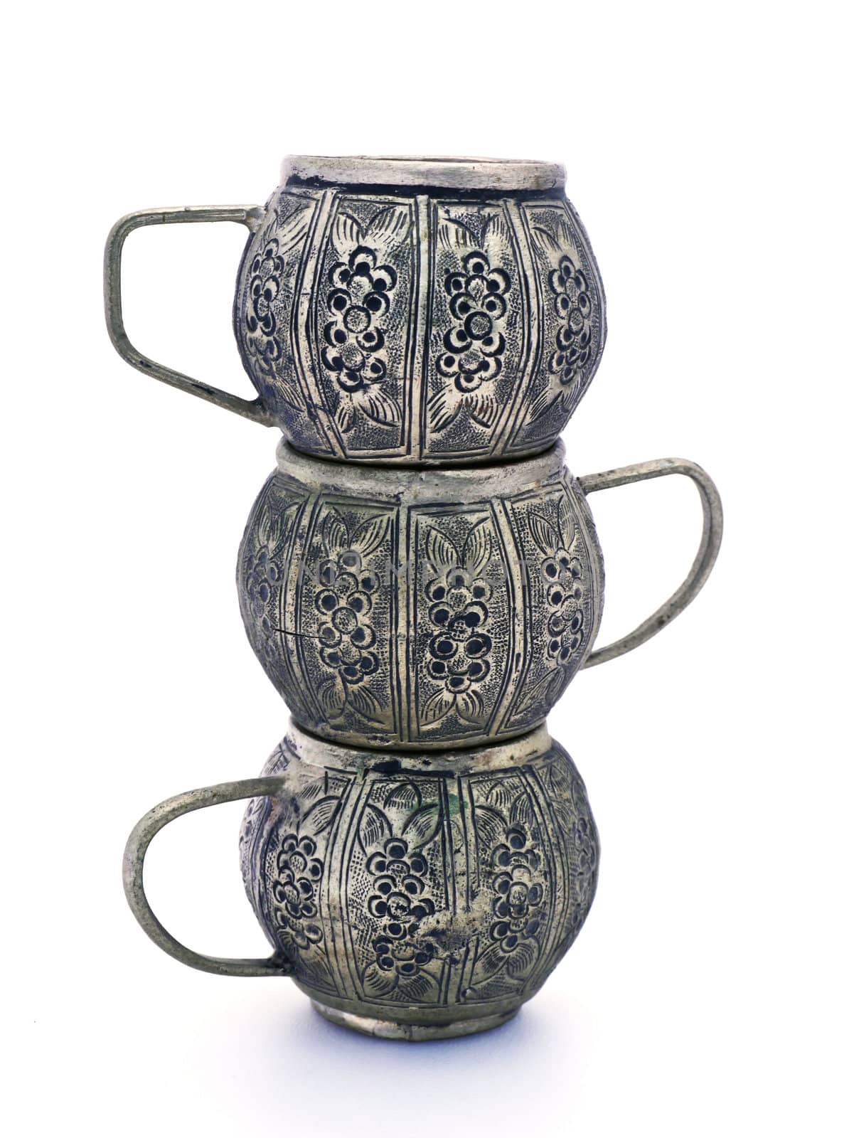 Antique tea pot and cups made ​​of metal, isolated on a whit by Noppharat_th