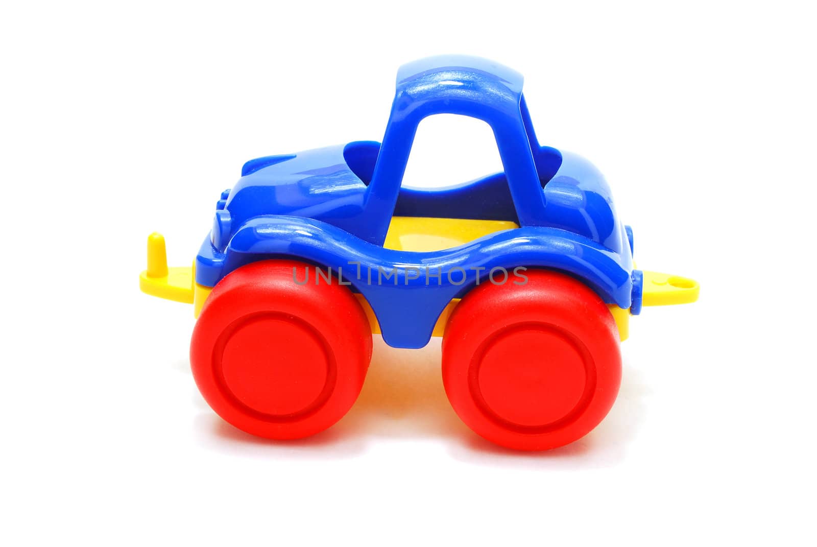 Tiny Blue Car Toy with Red Wheels Isolated on White