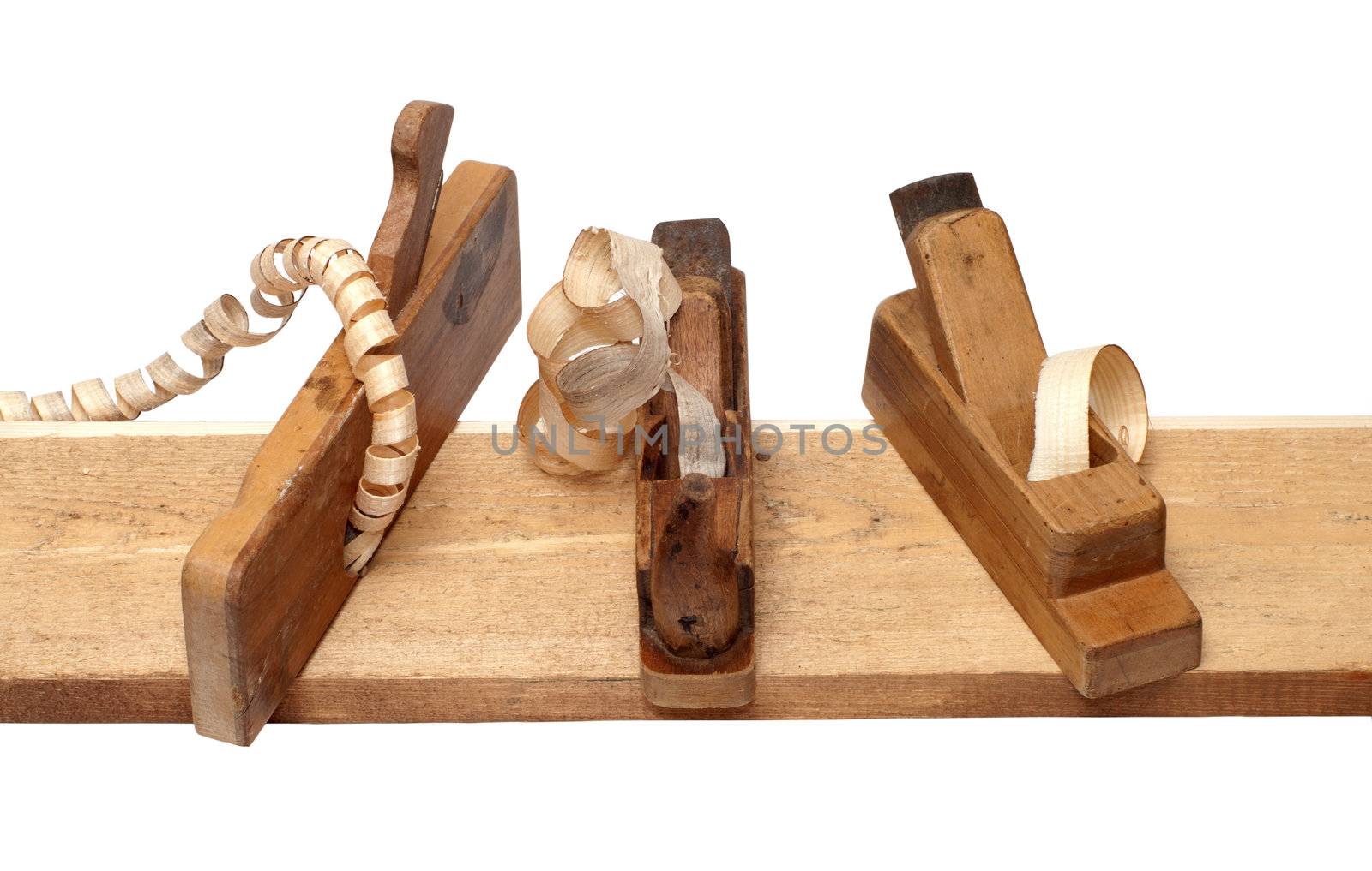 Three old planer on the board isolated on a white background.