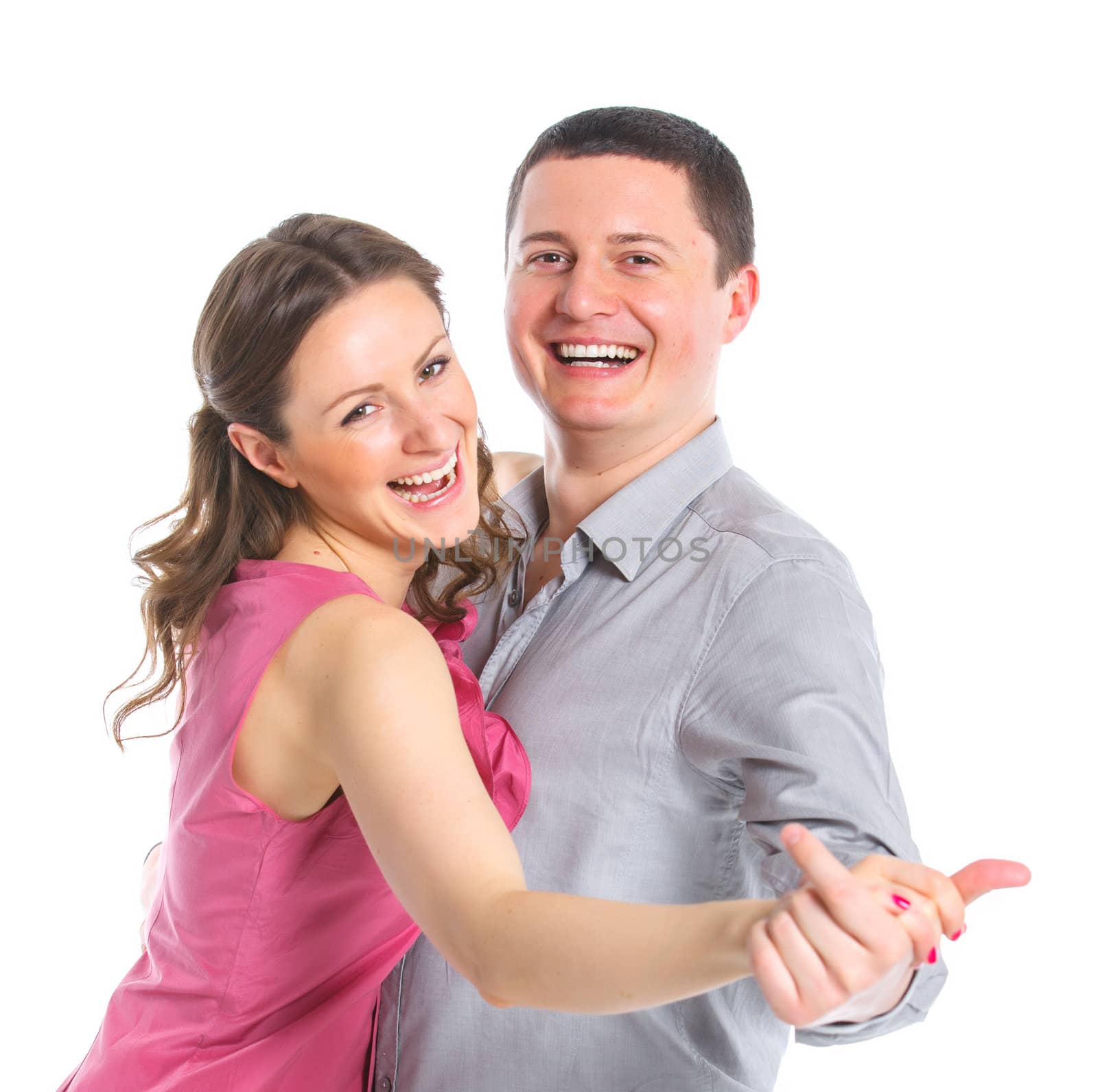 Portrait of a beautiful young happy smiling couple. Isolated white backround