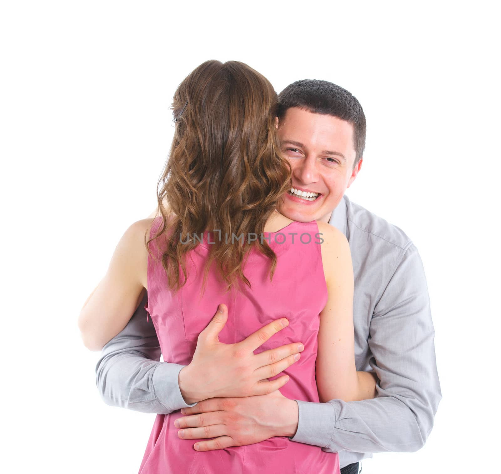 Portrait of a beautiful young happy smiling couple. Isolated white backround