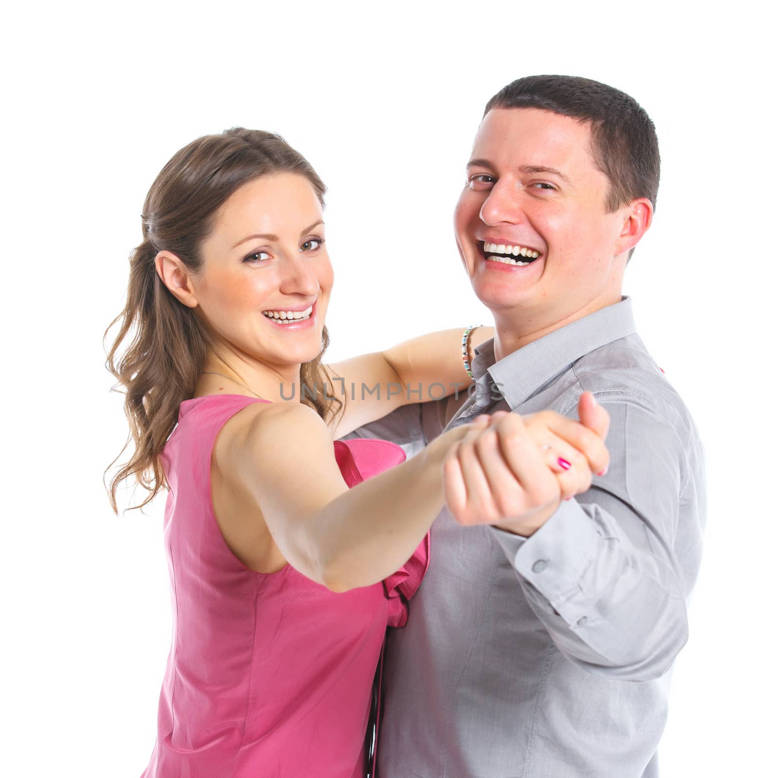 Portrait of a beautiful young happy smiling couple. Isolated white backround