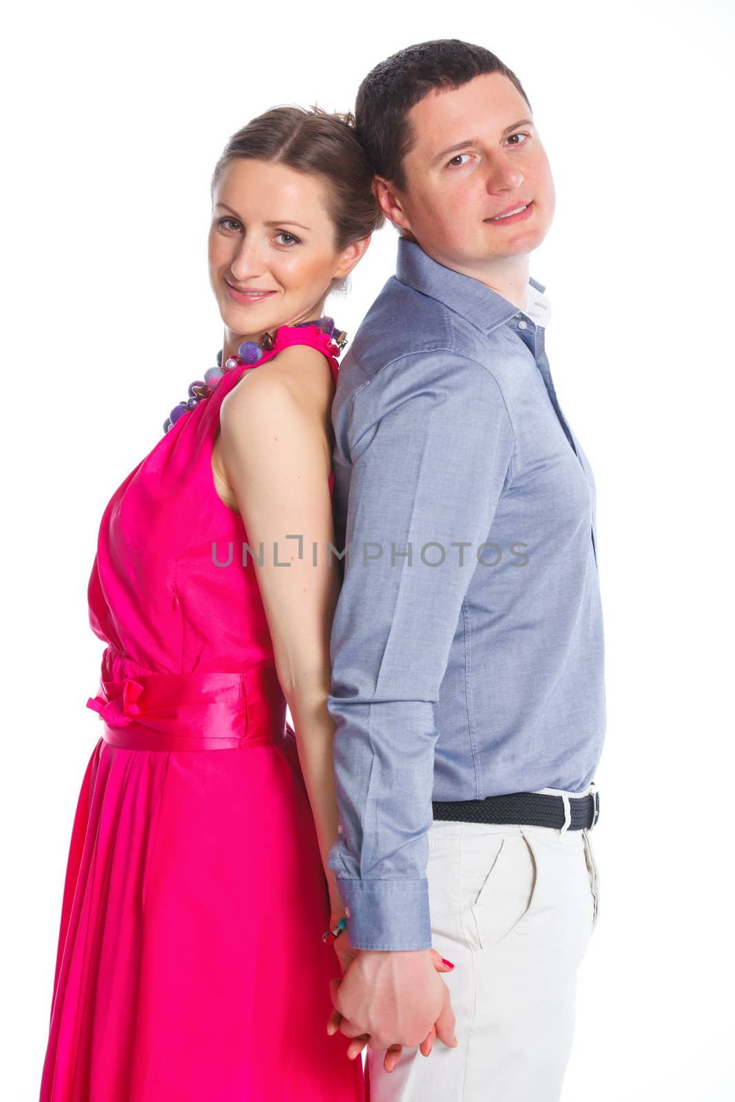 Portrait of a beautiful young happy smiling couple. Isolated white backround