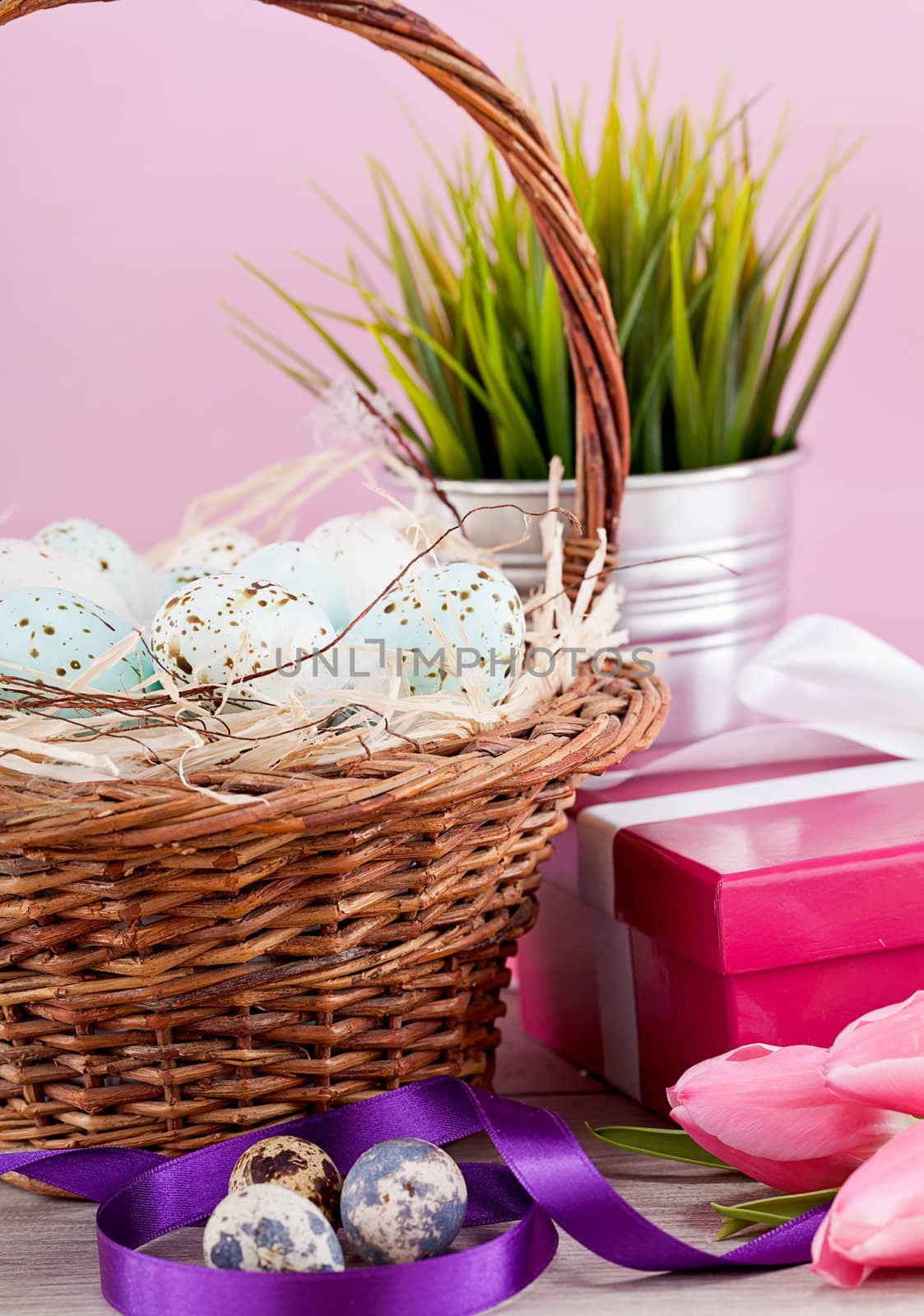 pink present with ribbon and colorful tulips festive easter decoration