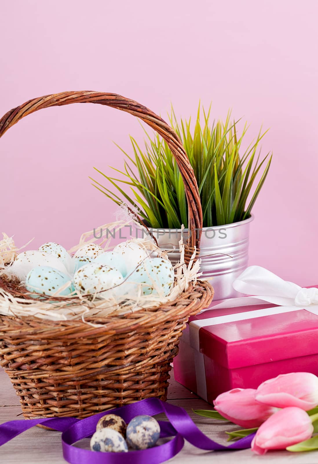 pink present with ribbon and colorful tulips festive easter decoration