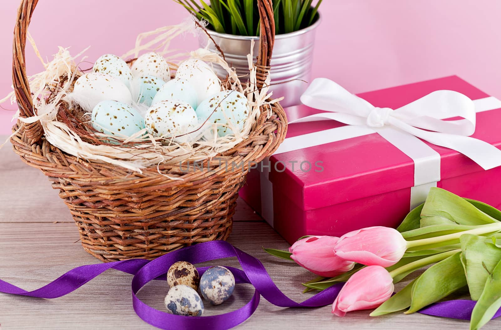 pink present with ribbon and colorful tulips festive easter decoration